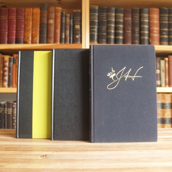 Collection of Seven Hardcover Books in Black Bindings - Free