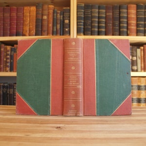 May include: A closed red and green hardcover book with the title "International Library of Technology" and the text "Magner Carpenter Jockey Steel Square" on the spine.