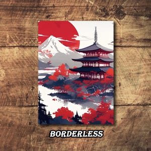 May include: An art print with a Japanese theme, showing a red sun, a multi-tiered pagoda, and a snow-covered mountain. The artwork uses red, white, grey, and black. The word "BORDERLESS" is printed at the bottom of the image.