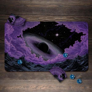 May include: A rectangular playmat featuring a space scene with a dark planet surrounded by purple clouds and a starry sky. Three blue multi-sided dice are scattered on the surface, and two fan-shaped card holders are placed at the corners.