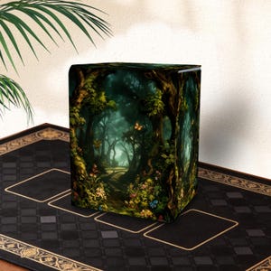 May include: A rectangular deck box featuring a dark, enchanted forest scene with dense trees, lush green foliage, colorful wildflowers, and small butterflies. The artwork displays a deep, moody color palette with highlights of yellow and blue.