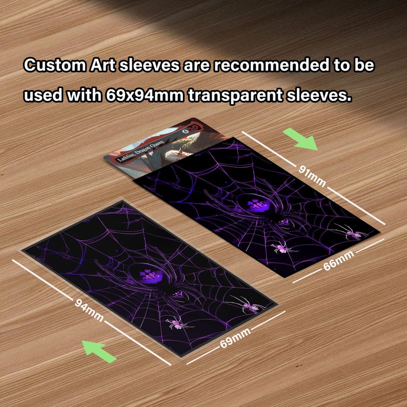 May include: Black card sleeves with a purple spiderweb design, measuring 2.7 inches by 3.7 inches. The sleeves are recommended for use with 69x94mm transparent sleeves. A card is partially visible.