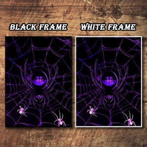 May include: Two framed Halloween-themed art prints. One features a black frame, the other a white frame. Each print displays a purple spider web design with a large spider in the center and smaller spiders. The text "BLACK FRAME" and "WHITE FRAME" is at the top.