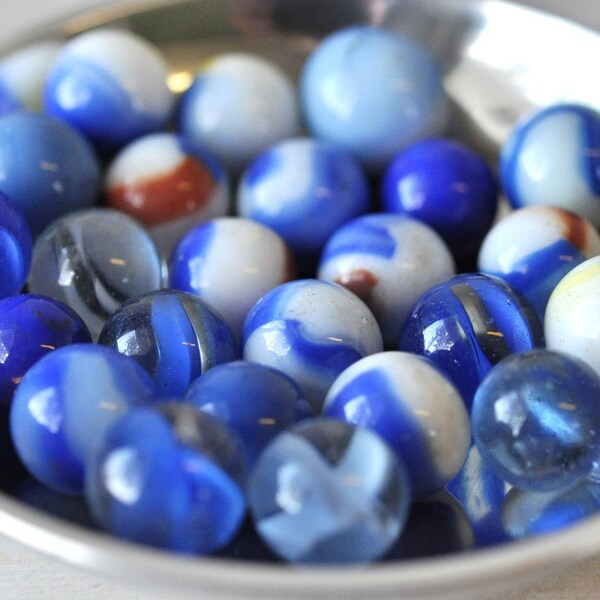bowl full of vintage blue, white and orange marbles--treasury item..