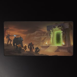 May include: A rectangular mousepad featuring a fantasy scene with warriors, a glowing green portal, and a desert landscape. The artwork has a dark, dramatic color palette with shades of orange, brown, and black. The mousepad is designed for gaming.