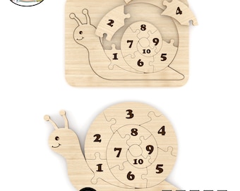 May include: A wooden snail puzzle with 10 numbered pieces. The snail is brown and has a smiling face. The puzzle is designed for children to learn numbers and problem-solving skills.