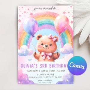 May include: A pink and purple birthday invitation with a rainbow, clouds, and a teddy bear holding balloons. The text reads "You're invited to... Olivia's 3rd Birthday, Saturday | March 20th | 4:30PM, Olivia's House, 123 Anywhere St., Any City CA 0987, RSVP to Momma at (555) 43210".