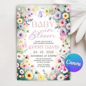 May include: A floral baby shower invitation with the text "BABY in Bloom." The invitation features a watercolor design with daisies, butterflies, and other flowers in pink, yellow, and purple. The invitation includes the date, time, and location.