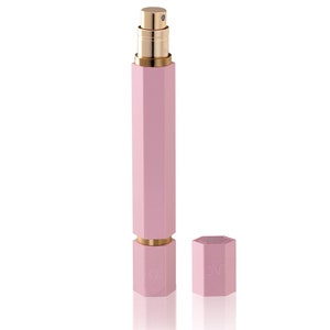 May include: A pink and gold refillable perfume bottle with a hexagonal design. The bottle has a cap that can be removed for refilling.