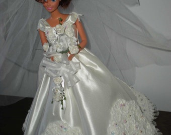 Bridal gown with veil, and bouquet