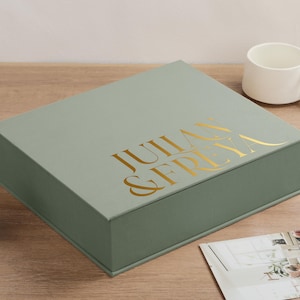 May include: A rustic wooden sign with the text "Welcome to our home" in white lettering. The sign has a distressed finish and a simple, inviting design, ideal for entryway decor.