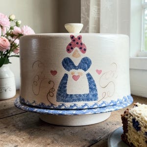 May include: A set of three ceramic mugs with a speckled, matte finish. The mugs are in shades of cream, light gray, and dark gray. Each mug has a simple, minimalist design and a rounded handle.