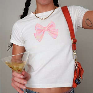 Coquette Bow Baby Tee, 2000s Cropped T-Shirt Y2K Style, Coquette Soft Girl Era Shirt, Gift, Trendy Clean Girl Retro Aesthetic Graphic Tee