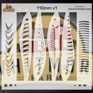 May include: A set of stencils with various designs, including fish shapes and decorative patterns. The stencils are white and feature cut-out designs. The text "110mm v1" is visible, along with the Whitmore Farm logo and website address.