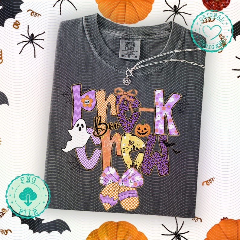May include: Dark gray Comfort Colors t-shirt with a Halloween-themed graphic. The design features the words "Boo Crew" in various patterns and colors, including purple, orange, and white, along with a ghost, pumpkin, and bats.