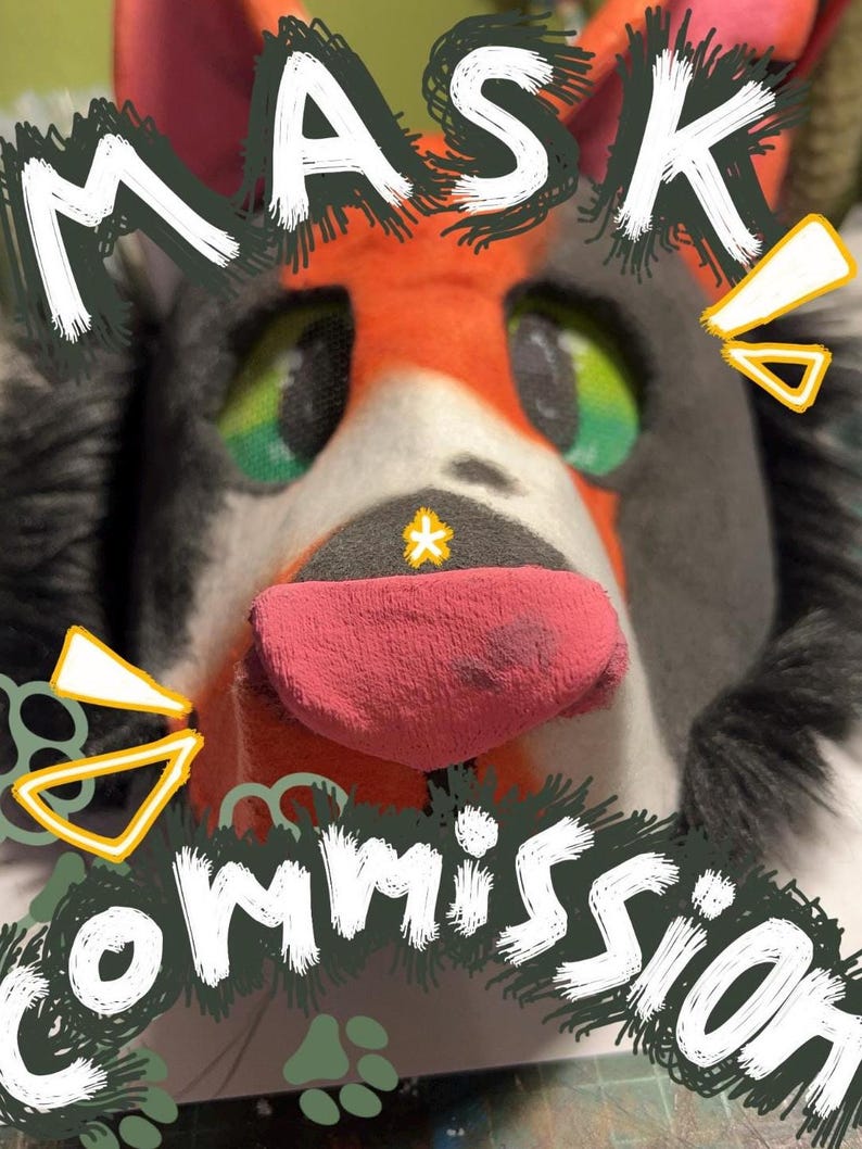 May include: A close-up of a furry mask with the word "MASK" and "COMMISSION" in white text. The mask has a red and orange face, green eyes, and a pink tongue. The mask is gray and white.