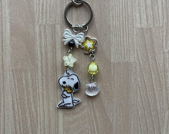 Sleepy Dog hug yellow bird charm beaded keychain