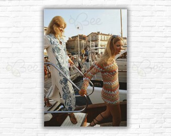 Slim Aarons Saint-Tropez Print/Poster: Two young women one wearing a kaftan stepping onto a yacht on the waterfront at Saint-Tropez France