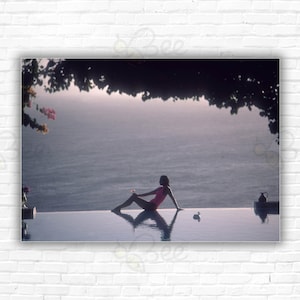 Slim Aarons Water Babe Print/Poster - &#39;Town & Country&#39; writer Meg O&#39;Neil relaxes by the pool on the island of Mustique, in the Grenadines.