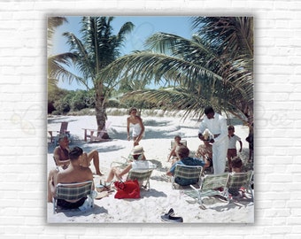 Slim Aarons  Drinks On The Beach Print/Poster - A waiter serves drinks on the beach at the Mill Reef Club on Antigua in the West Indies 1960