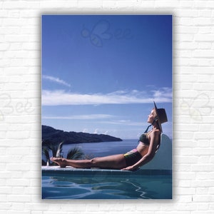 Slim Aarons Between Sea & Sky Print/Poster - Ingrid Morath sunbathing by pool near the sea in Acapulco, Mexico.