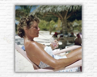 Slim Aarons  Beach Refreshment Print/Poster - A woman enjoys a drink on a beach on Antigua in the West Indies, 1960.