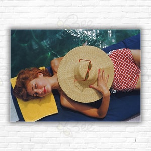 Slim Aarons Sunbathing in Burgenstock Print/Poster - Lilian Hanson sunbathing by the pool at Bürgenstock Resort Canton Nidwalden Switzerland