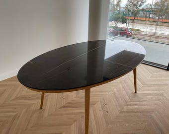 Oval marble table with oval wooden base