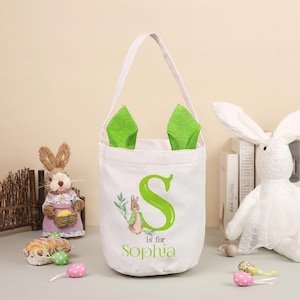 Personalisierte Osterkörbe, individuelle Ostergeschenke mit Monogrammen und Namen, Hasenohren, Eierbeutel, Geschenkkörbe für Kinder. Baby-Geschenke