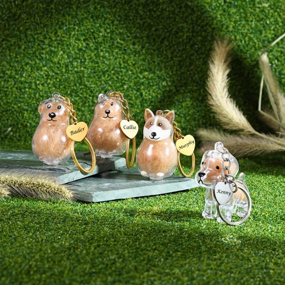 かわいいペットの毛のお土産キーホルダー。中に猫の毛が入った容器