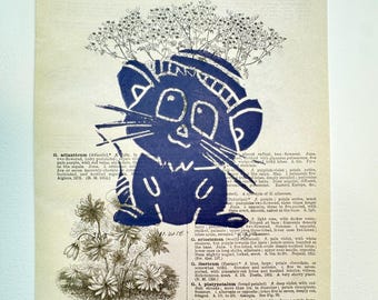 May include: A vintage page from an encyclopedia of horticulture features a navy blue illustration of a mouse wearing a hat. The page has text and botanical illustrations.