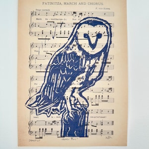 Barn Owl -linoleum print on musical score