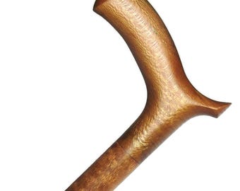 May include: A wooden walking stick with a brown, curved handle. The handle has a textured surface and a unique shape.