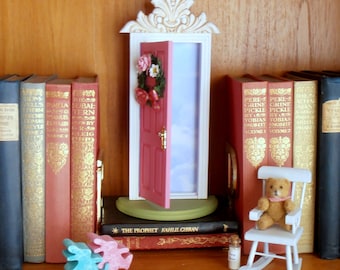 Pink Fairy Door or Tooth Fairy Door, opens outward, with architectural detail and handmade wreath