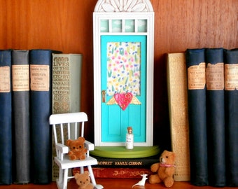 Fairy Door or Tooth Fairy Door, in turquoise, green, and pink, with architectural detail and flying heart, imaginative play