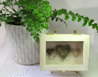 Small Whitewashed Wooden Shadowbox with Three Heart Shaped Rocks on Vintage-looking Script Background, for table top or shelf