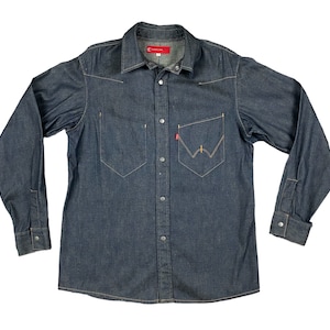 May include: A dark blue denim long-sleeved shirt with a button-down front and a single chest pocket. The shirt has a red Levi's label on the left side of the collar.