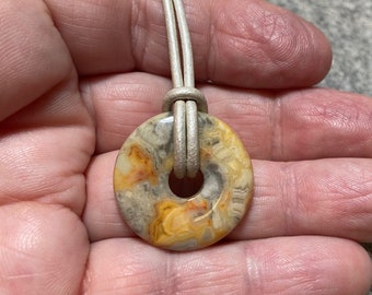 Yellow Crazy Lace Agate Donut Pendant on Leather Cord