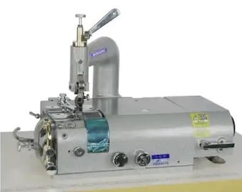 May include: A silver industrial sewing machine with a blue and white label. The machine has a lever on the top and a foot pedal on the bottom.