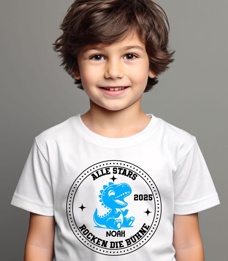 May include: White t-shirt with a black and blue circular graphic. The graphic features a blue dinosaur with the text "Alle Stars 2025 Rocken Die B&uuml;hne" and "Noah" in the center.