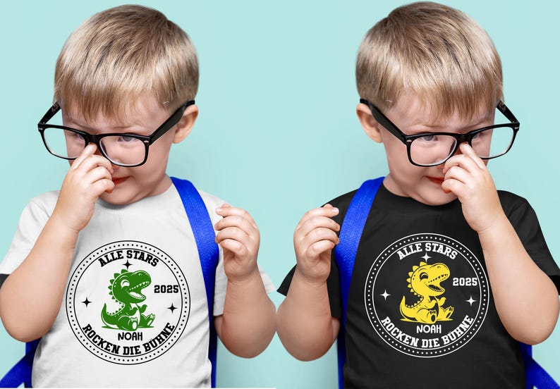 May include: Two children wearing black framed glasses and blue backpacks are wearing white and black t-shirts with a green and yellow dinosaur graphic. The shirts say "Alle Stars" and "Rocken die Buhne" with the year 2025.