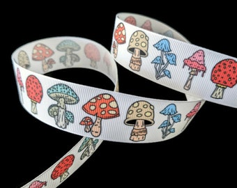May include: White ribbon with a repeating pattern of colorful mushrooms. The mushrooms are drawn in a cartoon style and have red, yellow, blue, and pink accents.