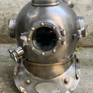 Premium Photo | Retrofuturistic Deep Sea Divers Helmet With A Porthole Window Helmet Is Made Riveted Metal Plates Has Steampunk Aesthetic 14117 386414