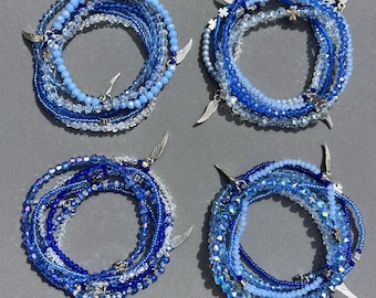 Blue Stackable 7 Strand Seed Bead Bracelet with Angel Wing Charms on a Stretch Cord