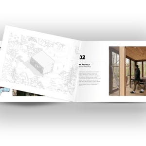 May include: An open book with architectural design illustrations. One page features a detailed sketch of a modern building in a natural setting. The opposite page shows a person walking inside a wooden structure with a table and chairs.