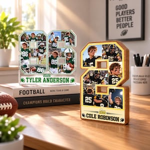 May include: Two custom photo displays shaped like the numbers 86 and 2. The number 86 is clear acrylic with green accents, featuring photos of a football player and the text Tyler Anderson Senior 2026. The number 2 is wood with yellow accents, featuring photos of a football player and the text Cole Robinson Senior 2026.