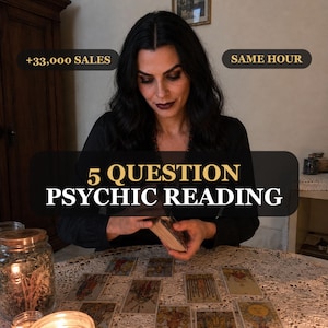 May include: A person with dark hair wearing a black shirt performs a 5 question psychic reading with tarot cards spread on a lace-covered table. Text overlays include +33,000 SALES, SAME HOUR, and 5 QUESTION PSYCHIC READING in gold and white.