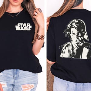 a woman wearing a star wars t - shirt