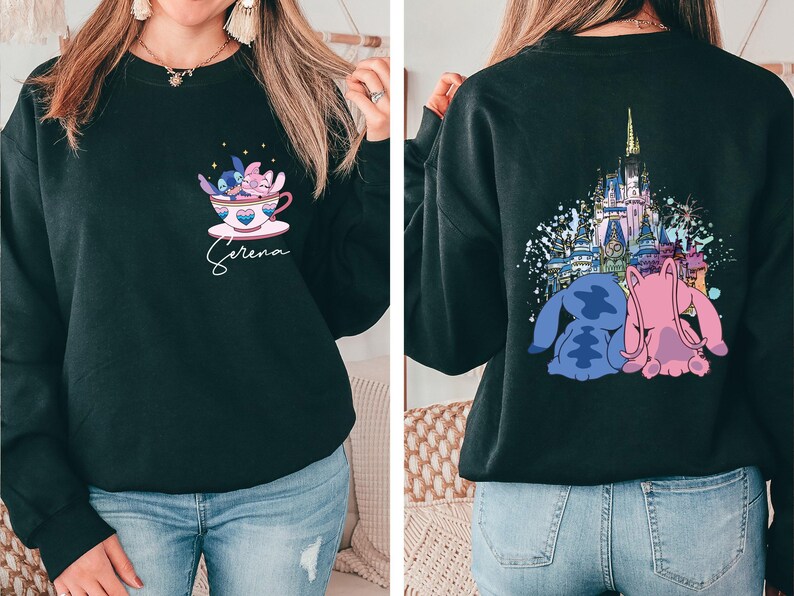 a woman wearing a black sweatshirt with a castle on it