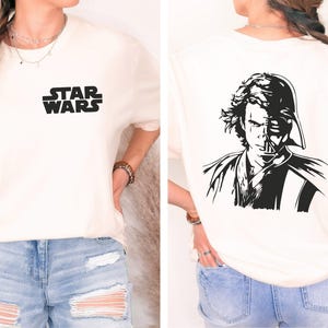 a woman wearing a star wars t - shirt